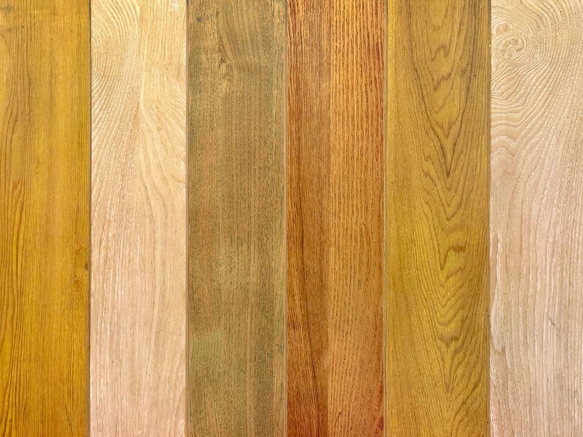 Close-up of solid hardwood planks with natural brown, beige, and white tones – vintage wood texture background